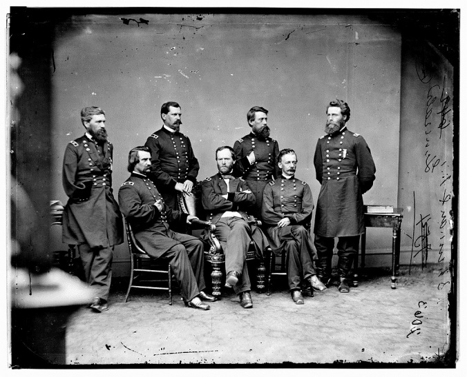 Maj. Gen. William T. Sherman, photographed at center in Washington in 1865 within a week or two of touring battlefields in the Fredericksburg area.  He rode with the Twentieth Army Corps and Maj. Gen. Henry W. Slocum, seated here at Sherman’s left, through Spotsylvania to Chancellorsville, and with the Fifteenth Corps and Major Gen. John Logan, seated at Sherman’s right, north from Fredericksburg.  Courtesy Library of Congress.